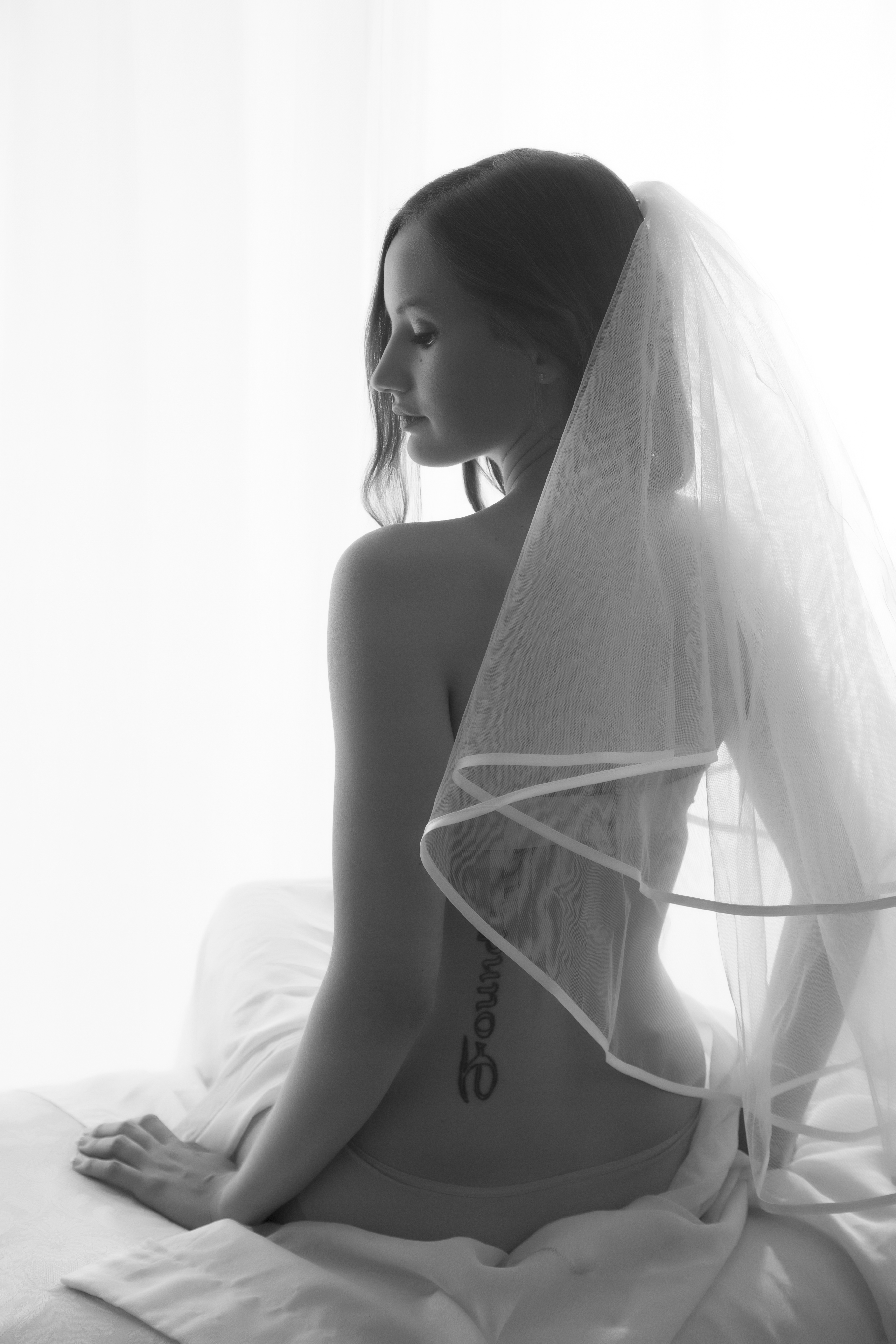 Bride in veil, artistic black and white.